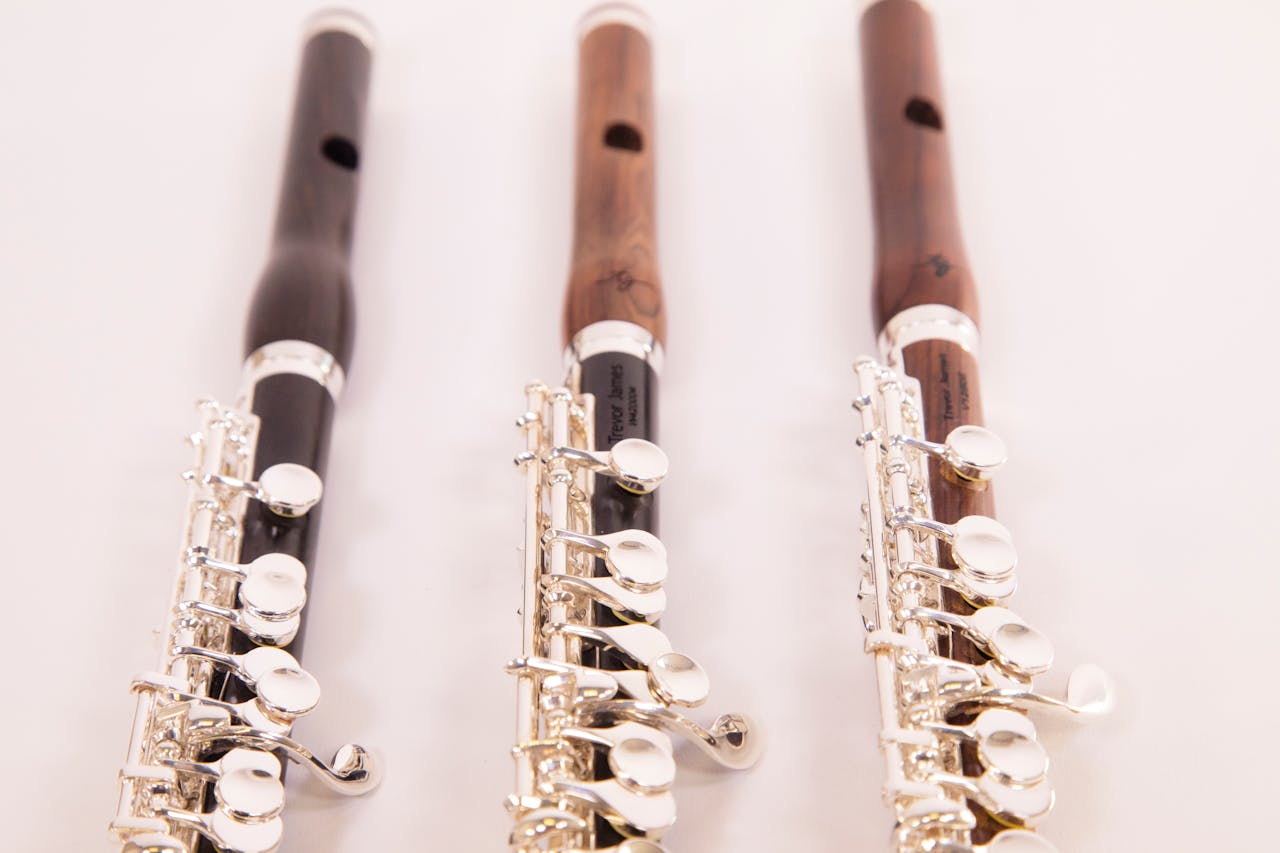 Close-up of three finely crafted flutes displayed in a London studio setting.